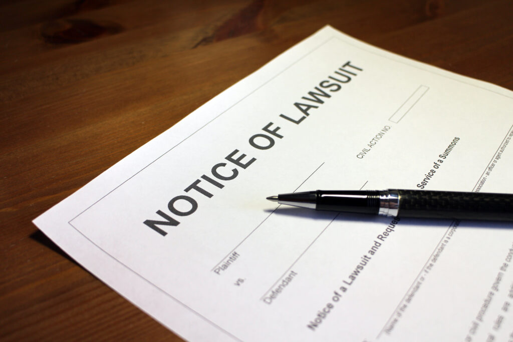 Someone filling out Notice of Lawsuit Form after a personal injury