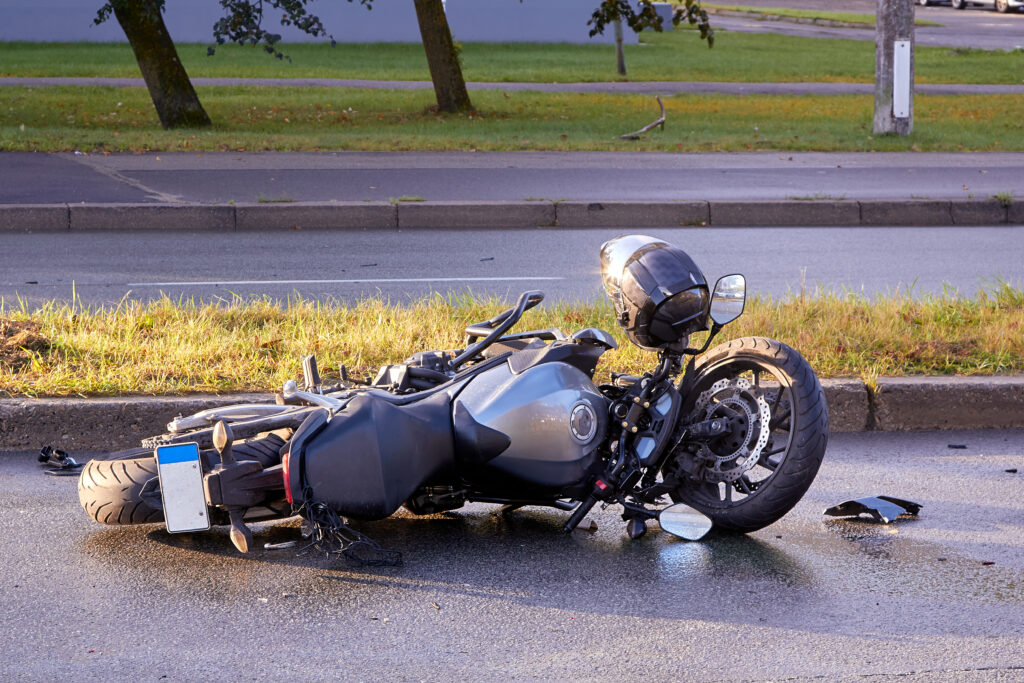 damaged motorcycle on the city road at the scene of an accident