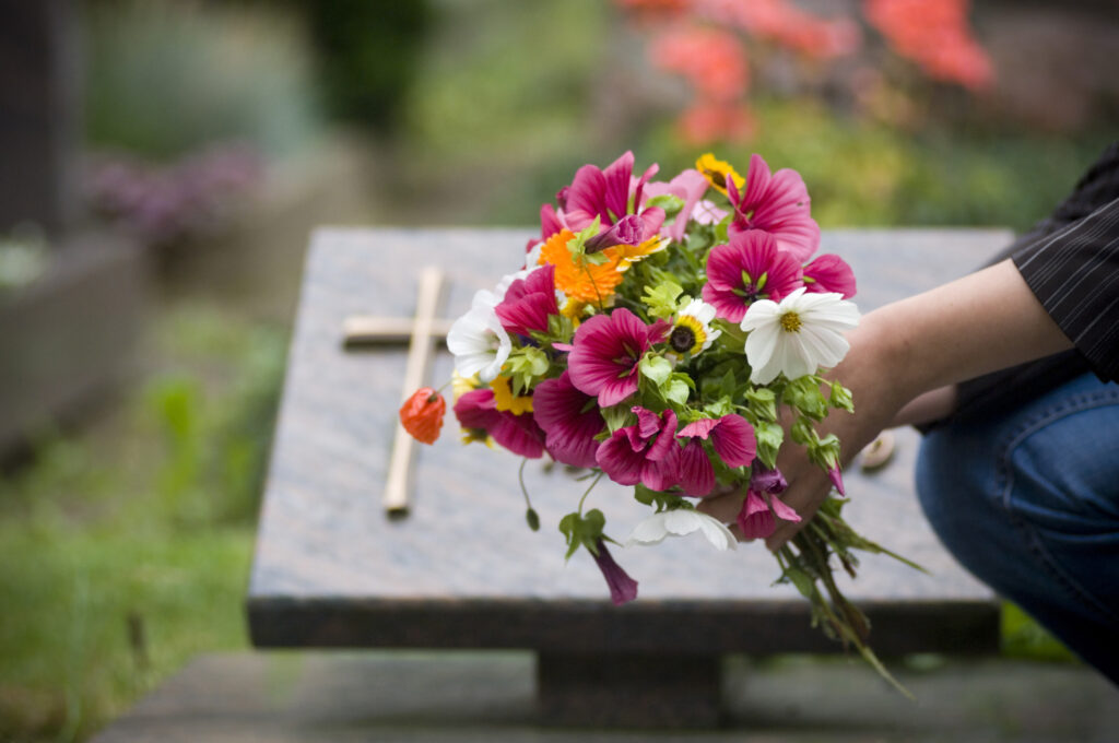flowers in front of a casket after a wrongful death